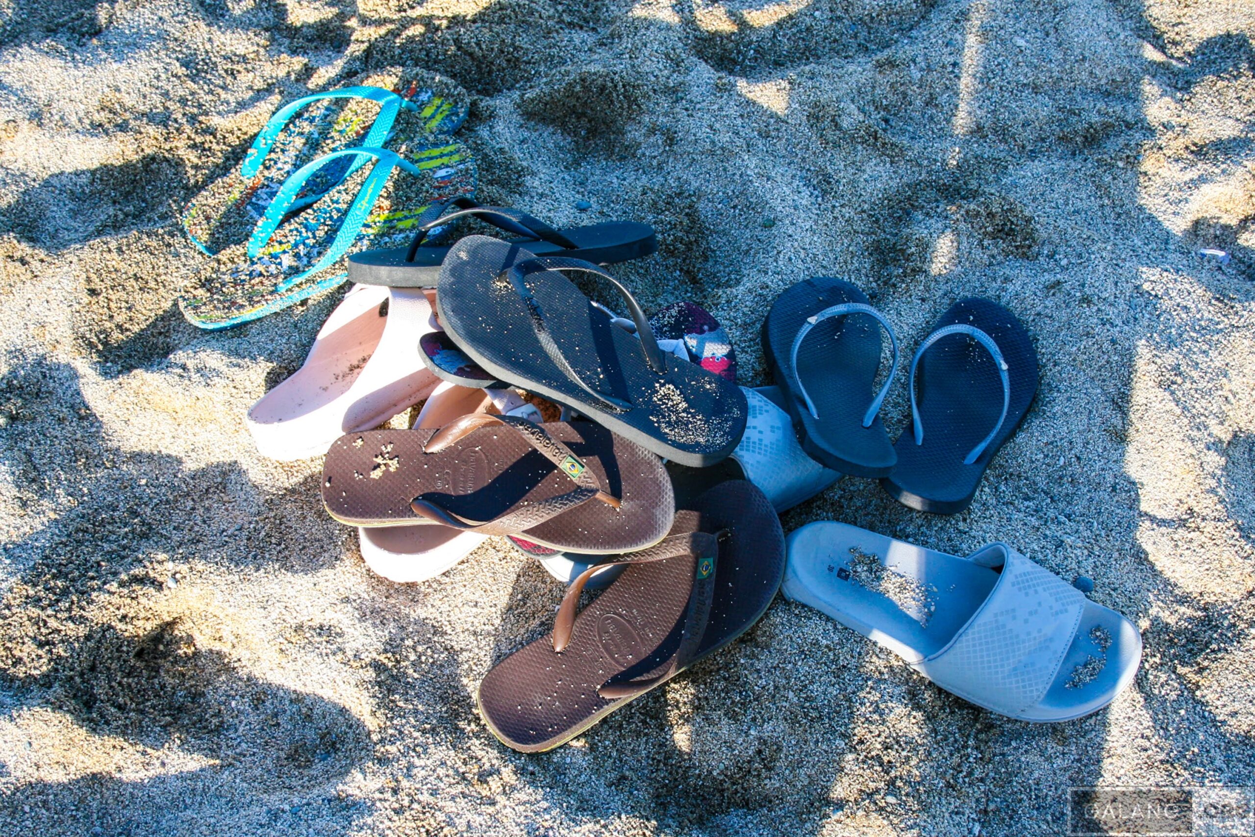 Sandy slippers left behind at the beach.